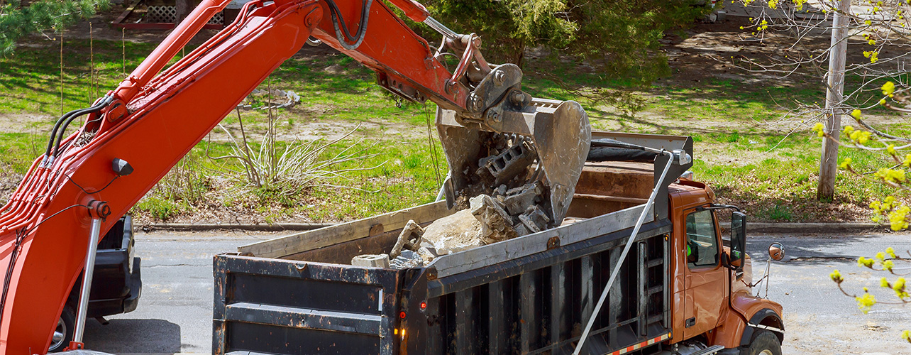 construction materials being put inside construction truck